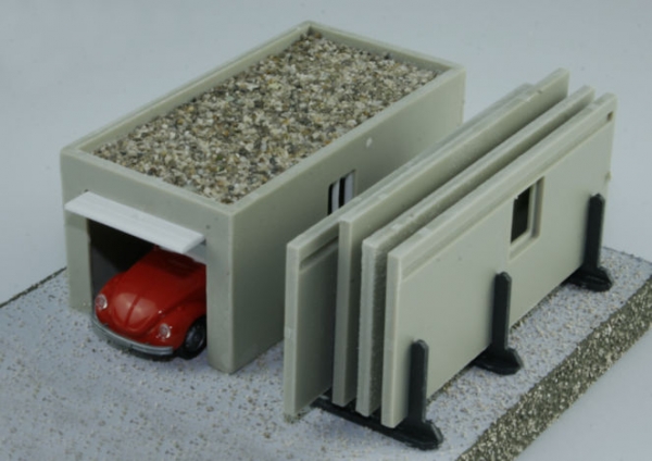 Precast garage with transport frame